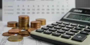 Calculator showing numbers with 2026 calendar and coins, representing 2026 Social Security COLA projections.